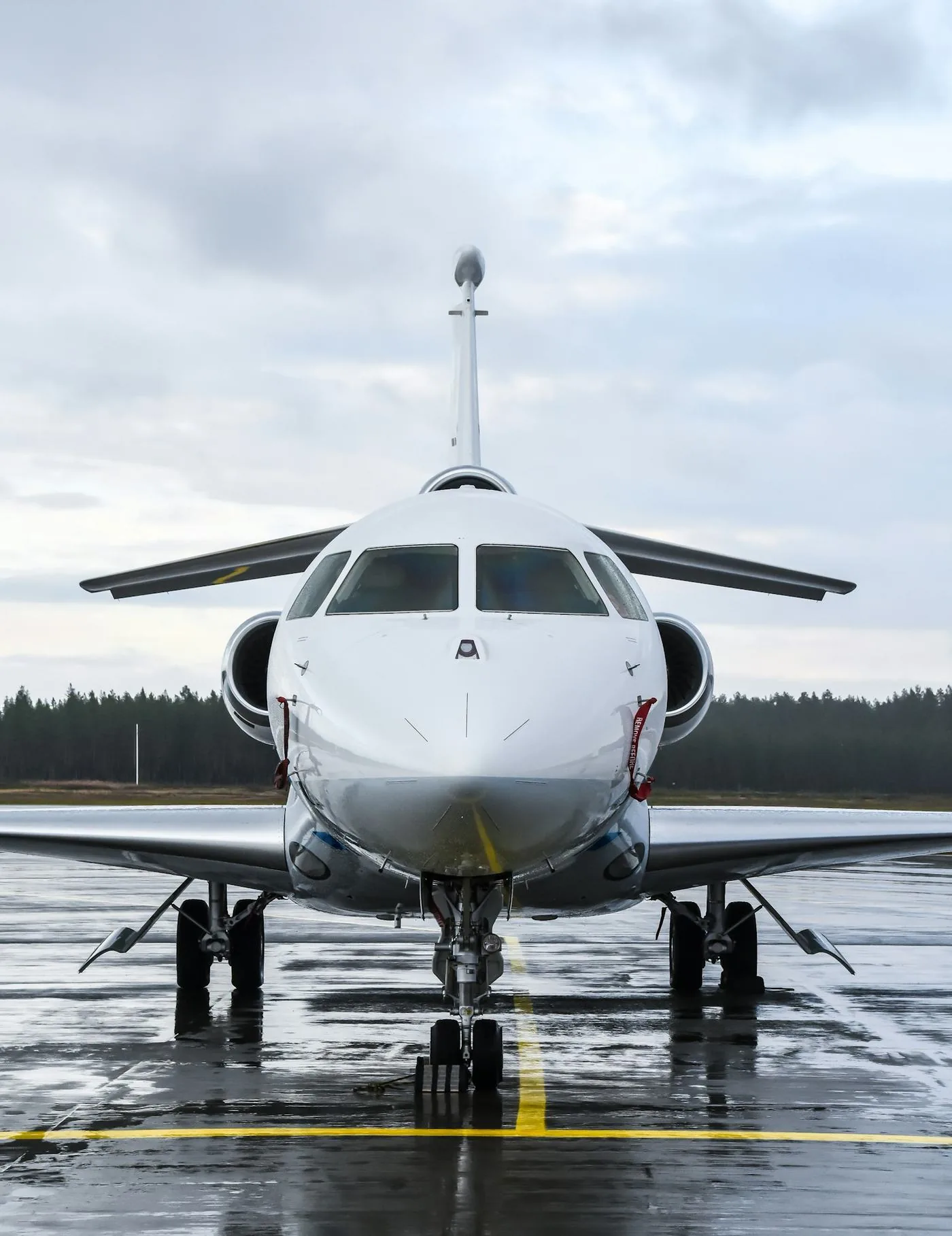 Business jet viewed from the front on an airport ramp